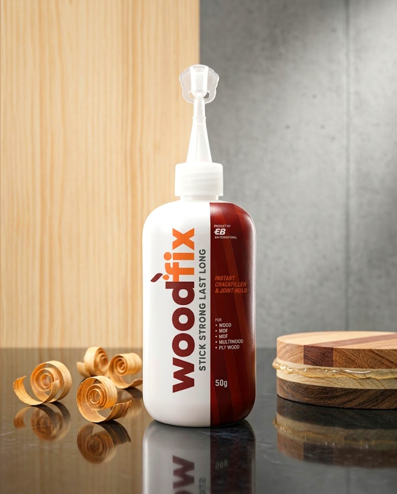 woodfix 50g bottle standing on a workshop surface with wood shavings